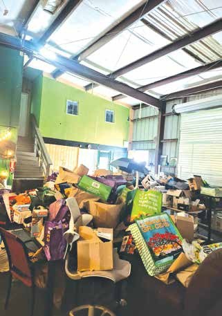 Those photographs show significant quantities of bags, boxes, furniture, trash, and other stored property occupying areas throughout portions of the building. Photo courtesy of Linda Sutter